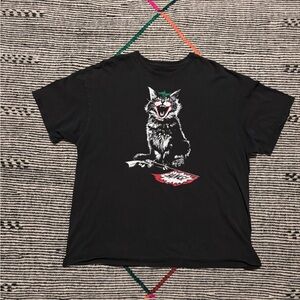 Vintage Black Graphic T-Shirt with bobcat stomping pistol Design